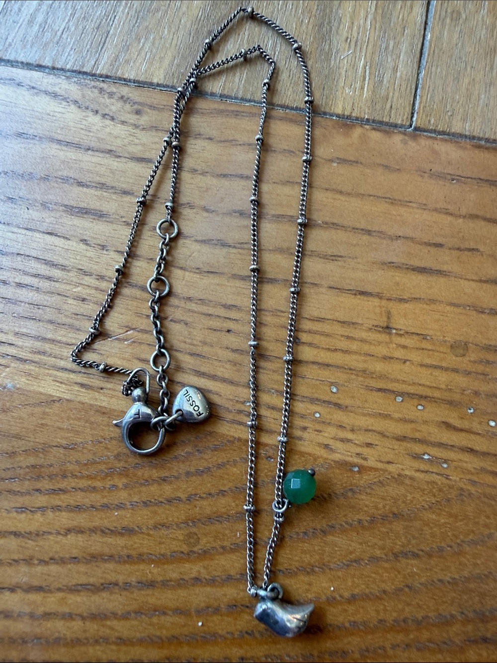 Fossil Silver-Tone Necklace with Green jade Bead and Bird Charm